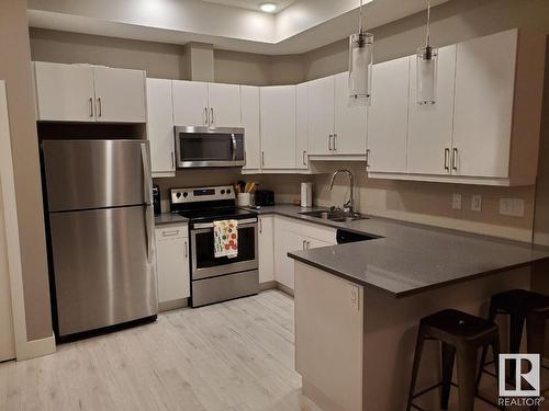 103 10006 83 Avenue, Edmonton, AB - Indoor Photo Showing Kitchen With Double Sink