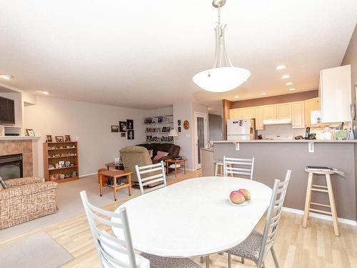 3219 31 Avenue, Edmonton, AB - Indoor Photo Showing Dining Room With Fireplace