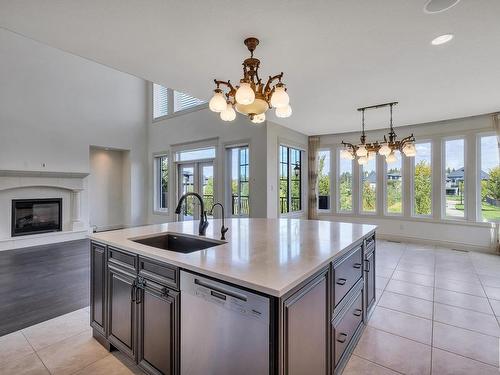 4409 Kennedy Cove, Edmonton, AB - Indoor Photo Showing Kitchen With Fireplace