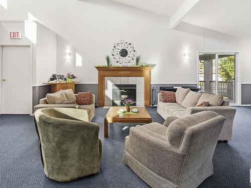 131 Knottwood Road N, Edmonton, AB - Indoor Photo Showing Living Room With Fireplace