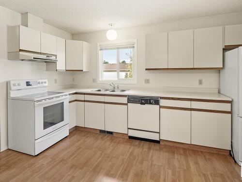 131 Knottwood Road N, Edmonton, AB - Indoor Photo Showing Kitchen With Double Sink