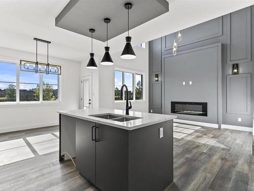 4723 168 Avenue, Edmonton, AB - Indoor Photo Showing Kitchen With Fireplace With Double Sink