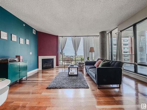 902 11933 Jasper Avenue, Edmonton, AB - Indoor Photo Showing Living Room With Fireplace