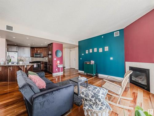 902 11933 Jasper Avenue, Edmonton, AB - Indoor Photo Showing Living Room With Fireplace