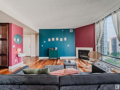 902 11933 Jasper Avenue, Edmonton, AB - Indoor Photo Showing Living Room With Fireplace