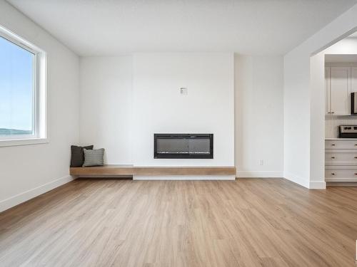 10245 92A Avenue, Morinville, AB - Indoor Photo Showing Living Room With Fireplace