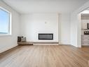 10245 92A Avenue, Morinville, AB  - Indoor Photo Showing Living Room With Fireplace 