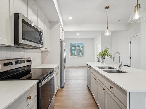 10245 92A Avenue, Morinville, AB - Indoor Photo Showing Kitchen With Double Sink With Upgraded Kitchen