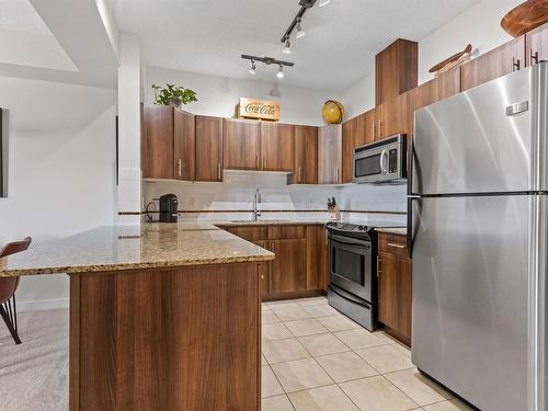 107 10333 112 Street, Edmonton, AB - Indoor Photo Showing Kitchen With Double Sink