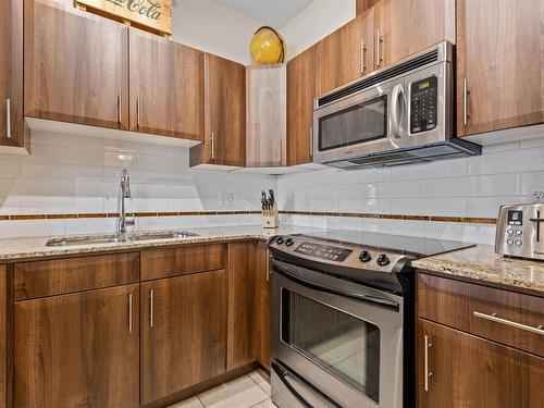 107 10333 112 Street, Edmonton, AB - Indoor Photo Showing Kitchen With Double Sink