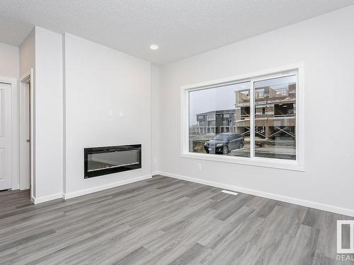 33 Gambel Loop, Spruce Grove, AB - Indoor Photo Showing Living Room With Fireplace