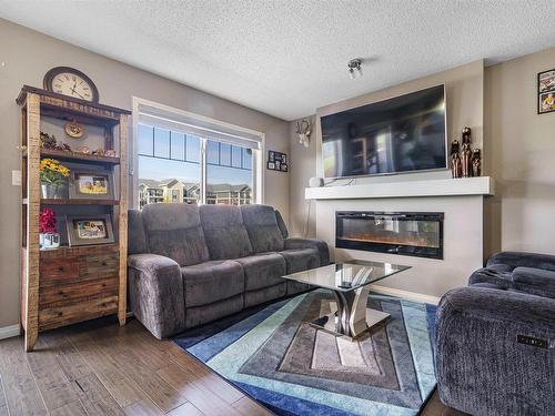 2304 86 Street, Edmonton, AB - Indoor Photo Showing Living Room With Fireplace