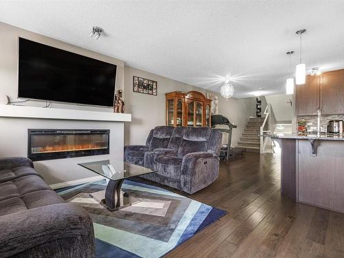 2304 86 Street, Edmonton, AB - Indoor Photo Showing Living Room With Fireplace