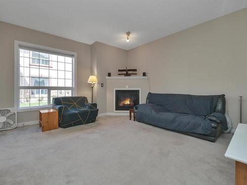 8 13825 155 Avenue, Edmonton, AB - Indoor Photo Showing Living Room With Fireplace