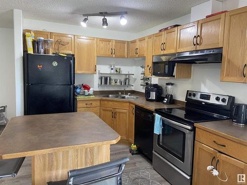 216 2305 35A Avenue, Edmonton, AB - Indoor Photo Showing Kitchen With Double Sink