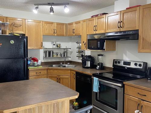 216 2305 35A Avenue, Edmonton, AB - Indoor Photo Showing Kitchen With Double Sink