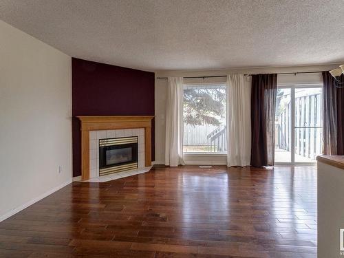 105 Bulyea Road, Edmonton, AB - Indoor Photo Showing Living Room With Fireplace