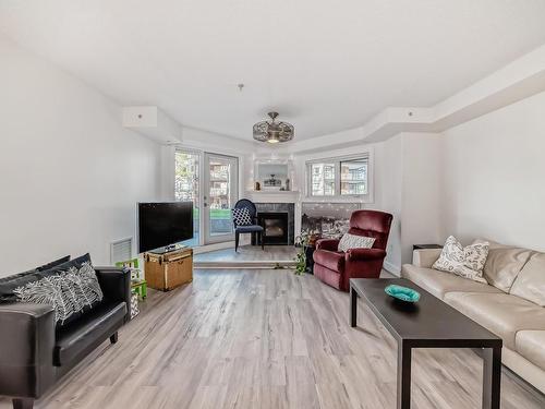 102 7905 96 Street, Edmonton, AB - Indoor Photo Showing Living Room With Fireplace