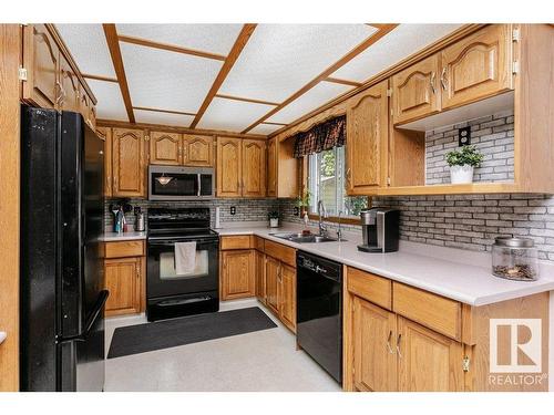 56 Alton Drive, Leduc, AB - Indoor Photo Showing Kitchen With Double Sink