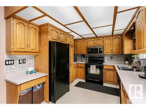 56 Alton Drive, Leduc, AB - Indoor Photo Showing Kitchen With Double Sink