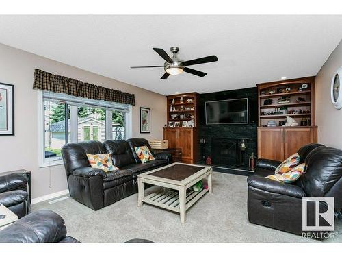 56 Alton Drive, Leduc, AB - Indoor Photo Showing Living Room With Fireplace