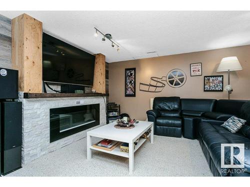 56 Alton Drive, Leduc, AB - Indoor Photo Showing Living Room With Fireplace