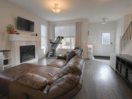 102 Gilmore Way, Spruce Grove, AB - Indoor Photo Showing Living Room With Fireplace