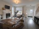 102 Gilmore Way, Spruce Grove, AB  - Indoor Photo Showing Living Room With Fireplace 