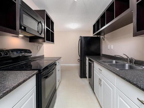 404 57 Brown Street, Stony Plain, AB - Indoor Photo Showing Kitchen With Double Sink