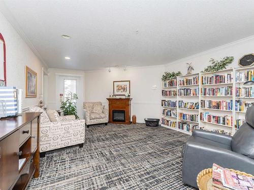 213 69 Crystal Lane, Sherwood Park, AB - Indoor Photo Showing Living Room With Fireplace