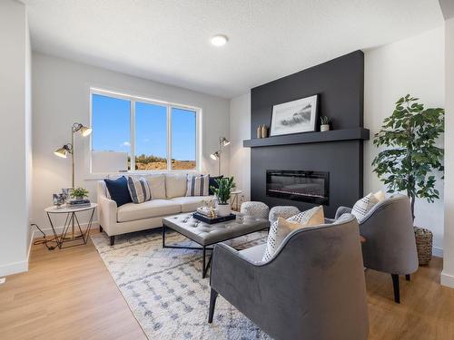 119 Brickyard Drive, Stony Plain, AB - Indoor Photo Showing Living Room With Fireplace