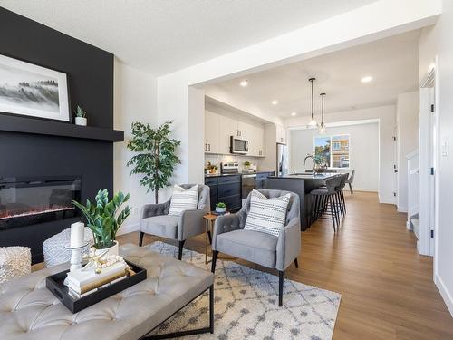 10241 92A Avenue, Morinville, AB - Indoor Photo Showing Living Room With Fireplace