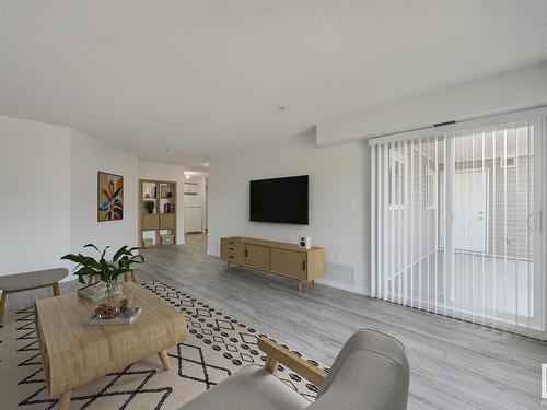 309 8117 114 Avenue, Edmonton, AB - Indoor Photo Showing Living Room