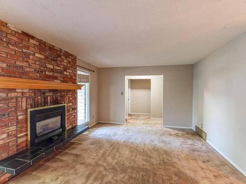 47 Linwood Crescent, St. Albert, AB - Indoor Photo Showing Living Room With Fireplace