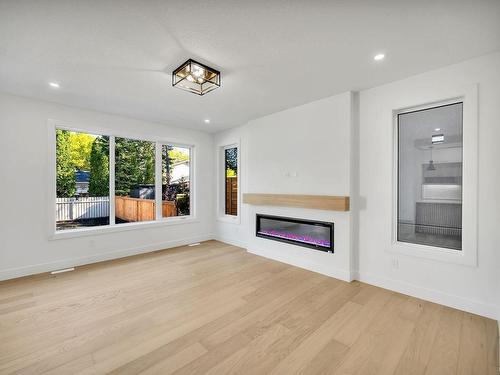 7717 158 Street, Edmonton, AB - Indoor Photo Showing Living Room With Fireplace