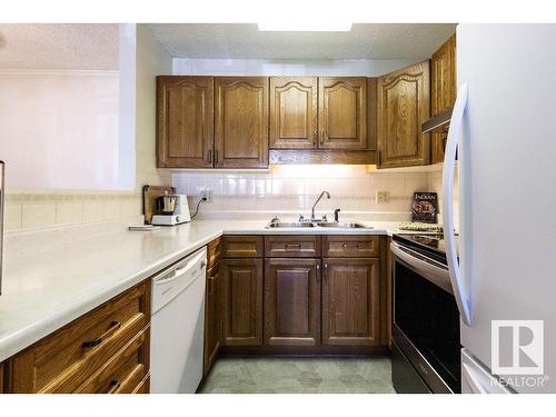 218 17151 94A Avenue, Edmonton, AB - Indoor Photo Showing Kitchen With Double Sink