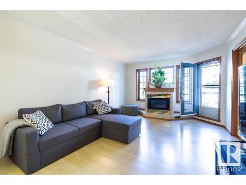 218 17151 94A Avenue, Edmonton, AB - Indoor Photo Showing Living Room With Fireplace