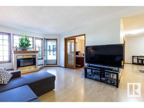 218 17151 94A Avenue, Edmonton, AB - Indoor Photo Showing Living Room With Fireplace