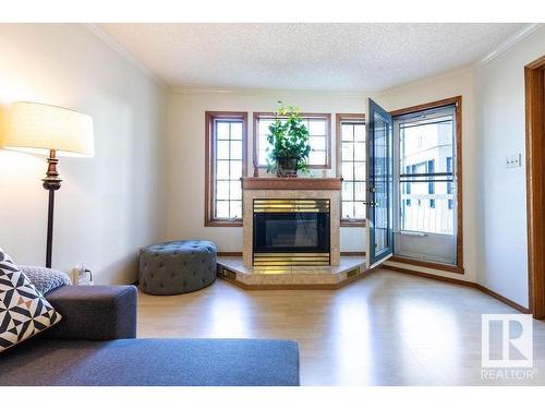 218 17151 94A Avenue, Edmonton, AB - Indoor Photo Showing Living Room With Fireplace