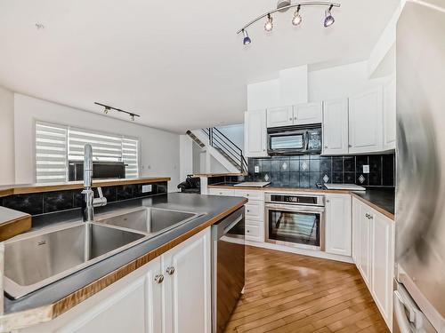 114 10933 82 Avenue, Edmonton, AB - Indoor Photo Showing Kitchen With Double Sink