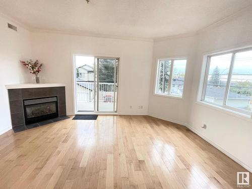 229 8528 82 Avenue, Edmonton, AB - Indoor Photo Showing Living Room With Fireplace