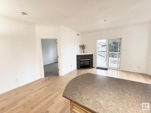 229 8528 82 Avenue, Edmonton, AB - Indoor Photo Showing Living Room With Fireplace