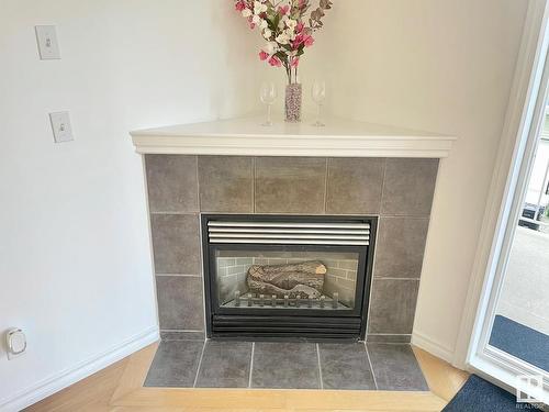 229 8528 82 Avenue, Edmonton, AB - Indoor Photo Showing Living Room With Fireplace