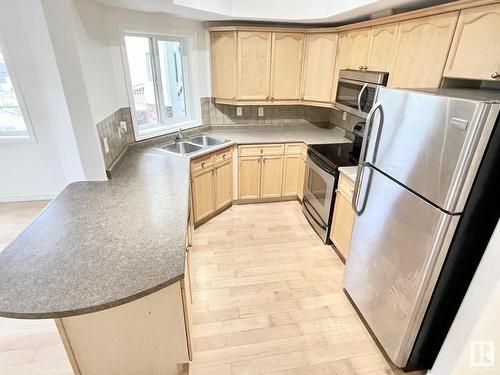 229 8528 82 Avenue, Edmonton, AB - Indoor Photo Showing Kitchen With Double Sink