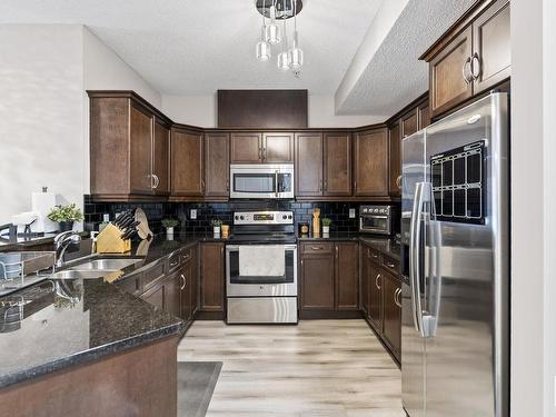 105 7907 109 Street, Edmonton, AB - Indoor Photo Showing Kitchen With Stainless Steel Kitchen With Double Sink