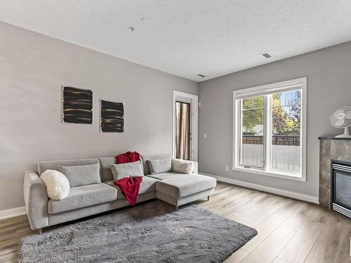 105 7907 109 Street, Edmonton, AB - Indoor Photo Showing Living Room With Fireplace