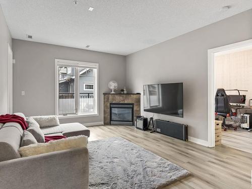 105 7907 109 Street, Edmonton, AB - Indoor Photo Showing Living Room With Fireplace