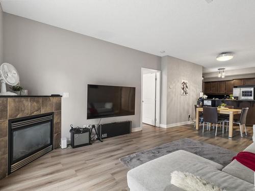 105 7907 109 Street, Edmonton, AB - Indoor Photo Showing Living Room With Fireplace