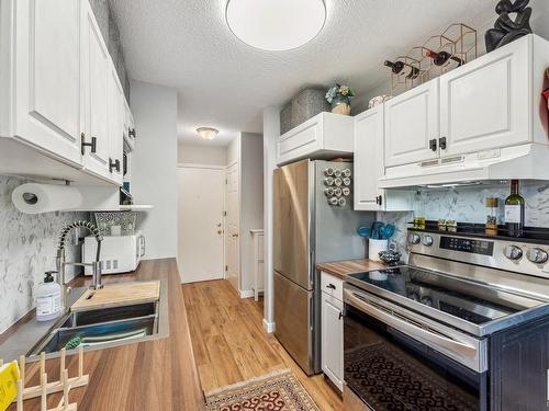 18 11219 103A Avenue, Edmonton, AB - Indoor Photo Showing Kitchen With Stainless Steel Kitchen With Double Sink