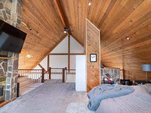 48343 Range Road 222, Rural Camrose County, AB - Indoor Photo Showing Bedroom With Fireplace